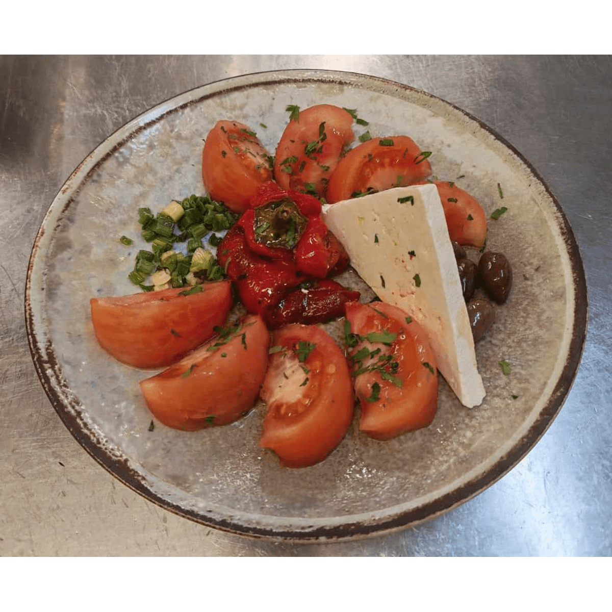 Pink tomatoes with roasted peppers and cheese